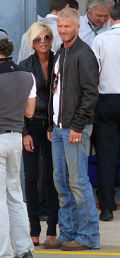 Beckham with her husband David in Silverstone Circuit during the British Grand Prix in July 2007